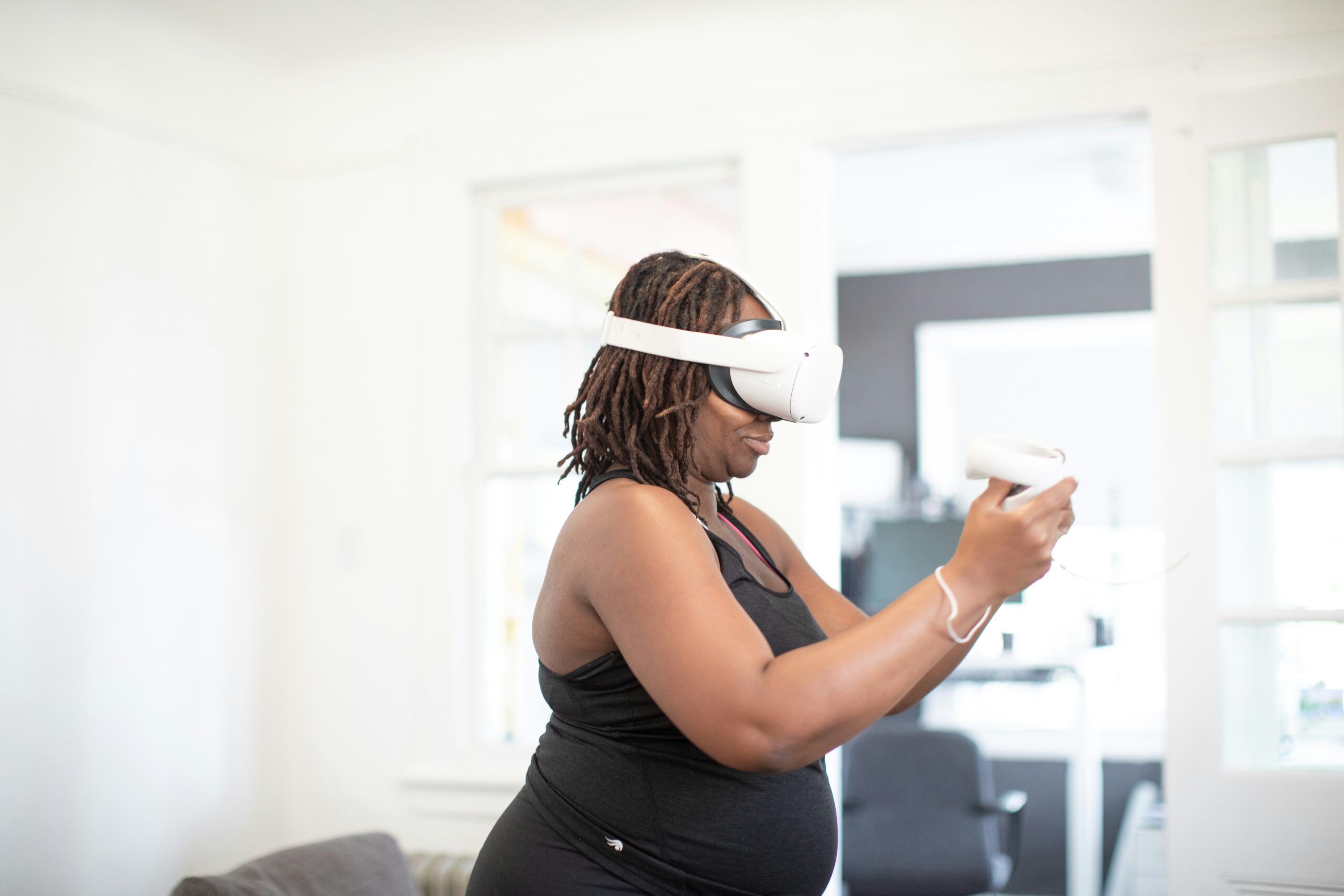 Keywords:
Woman wearing mixed reality headset interacting with virtual data - a woman wearing a vr headset