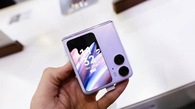 Person using foldable smartphone - OnePlus Confirms Its Foldable Smartphone Is Coming Later This Year