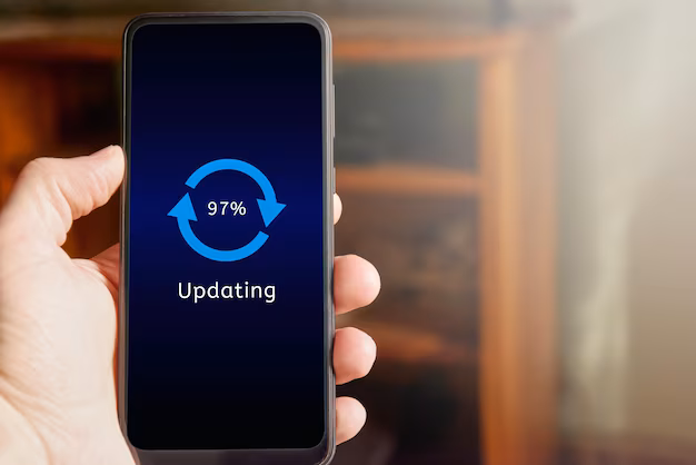 Person updating smartphone - Male hand holding mobile phone showing update interface and icon ...